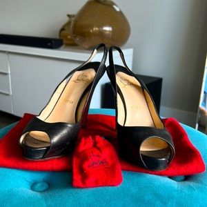 Christian Louboutin black leather slingback Pump.